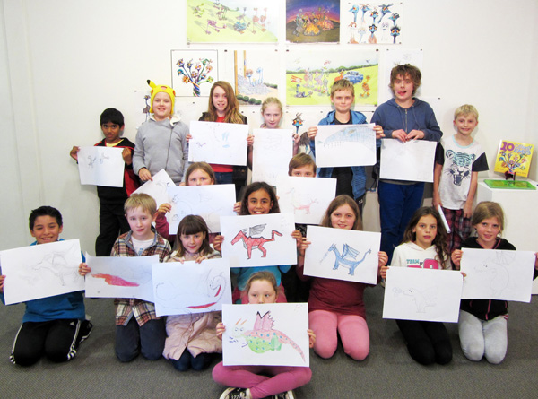 Homeschoolers show their cartoons created with James Foley.jpg