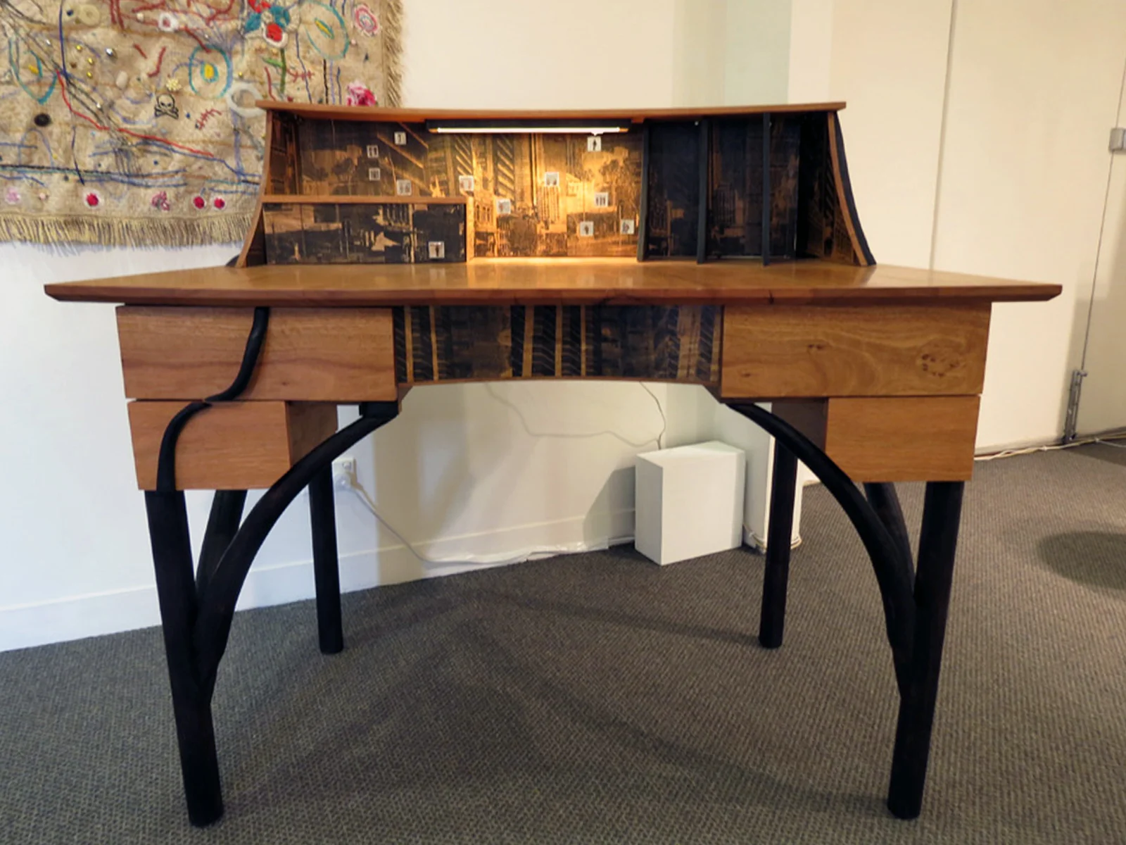  14.&nbsp; Lost in the Wood , Megan Christie, Blackbutt, Marri, charred finish, screen printed veneer, cast copper figures, LED light,&nbsp;$6500 