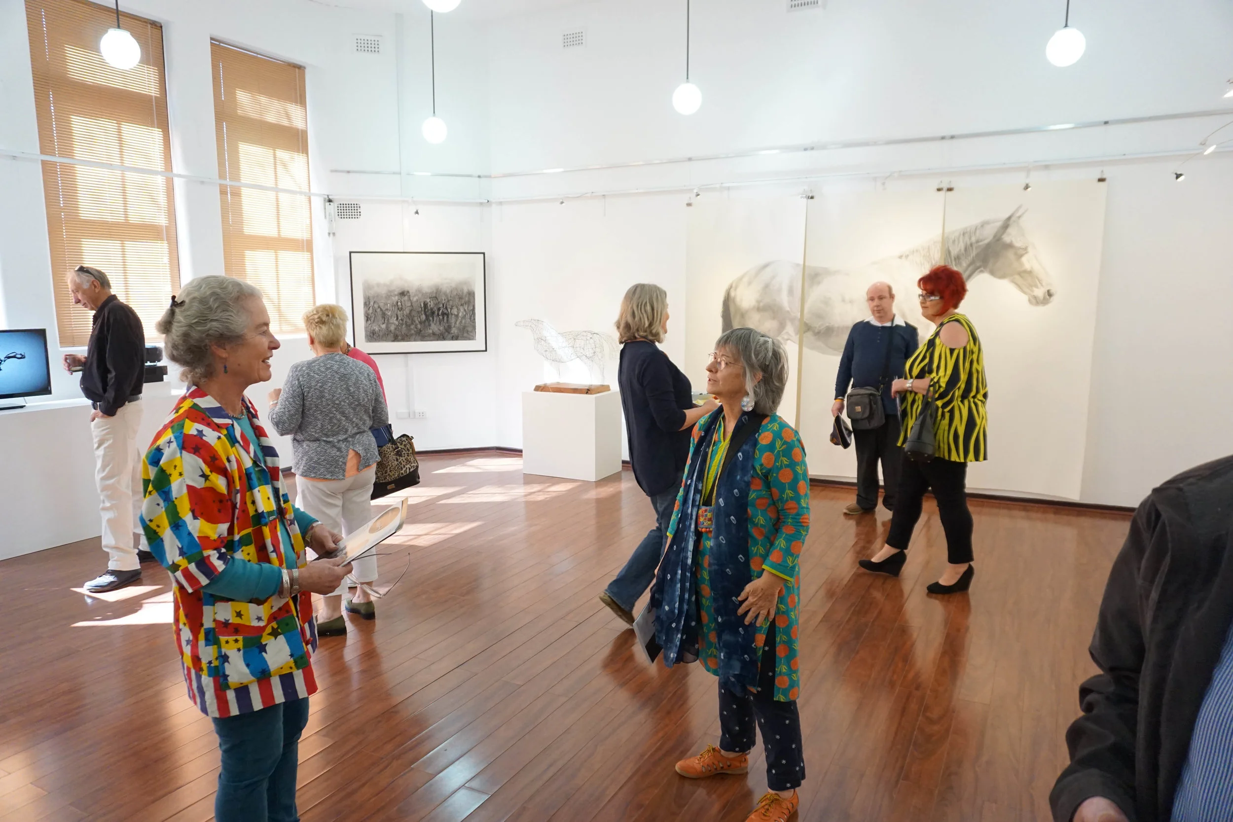 Image: In the foreground 'Horse Drawn' exhibiting artists Madeleine Clear and Linda van der Merwe
