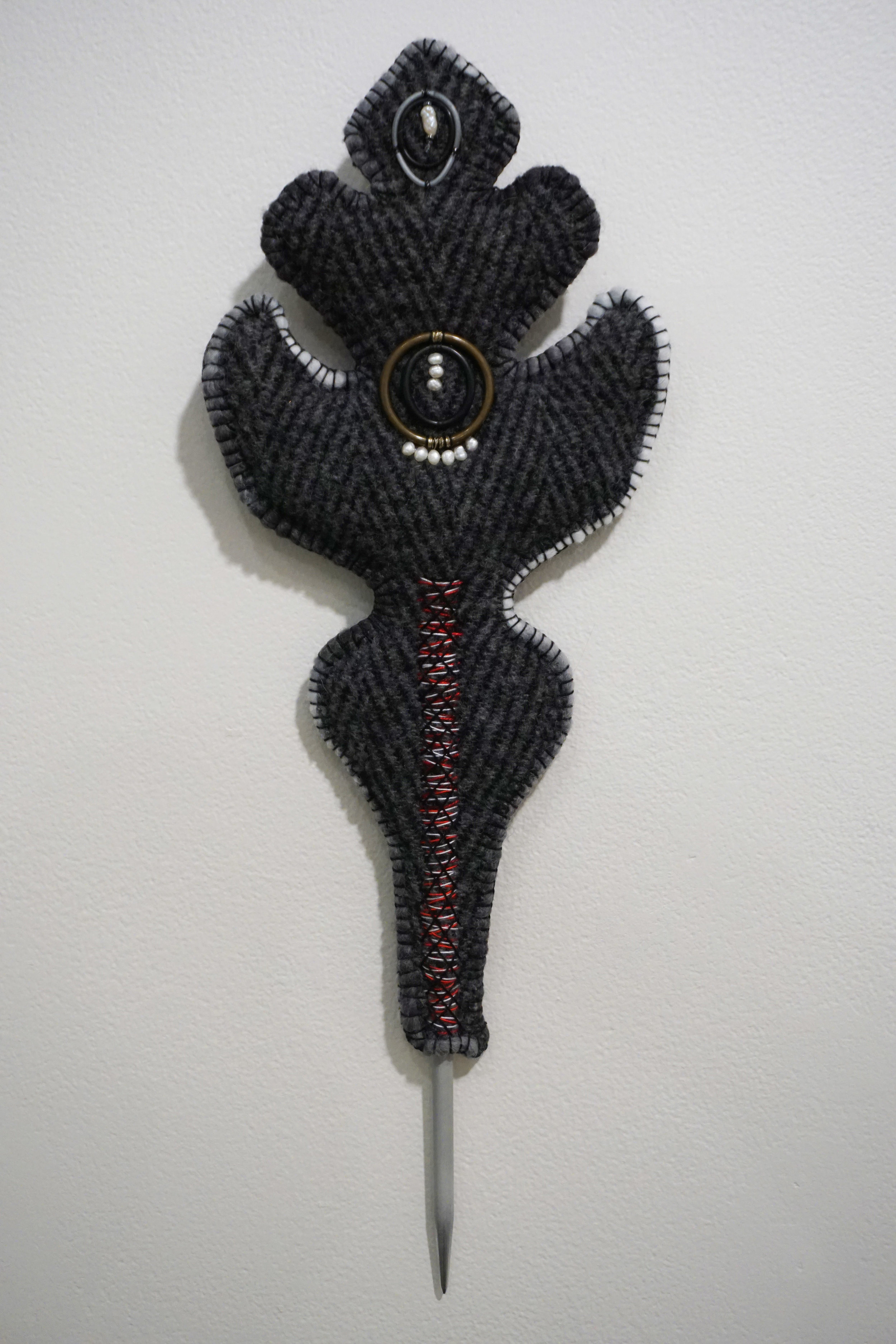  34. Katrina Virgona,  The May Queen , Knitting needle, blanket, found objects, glass beads and pearls $275 