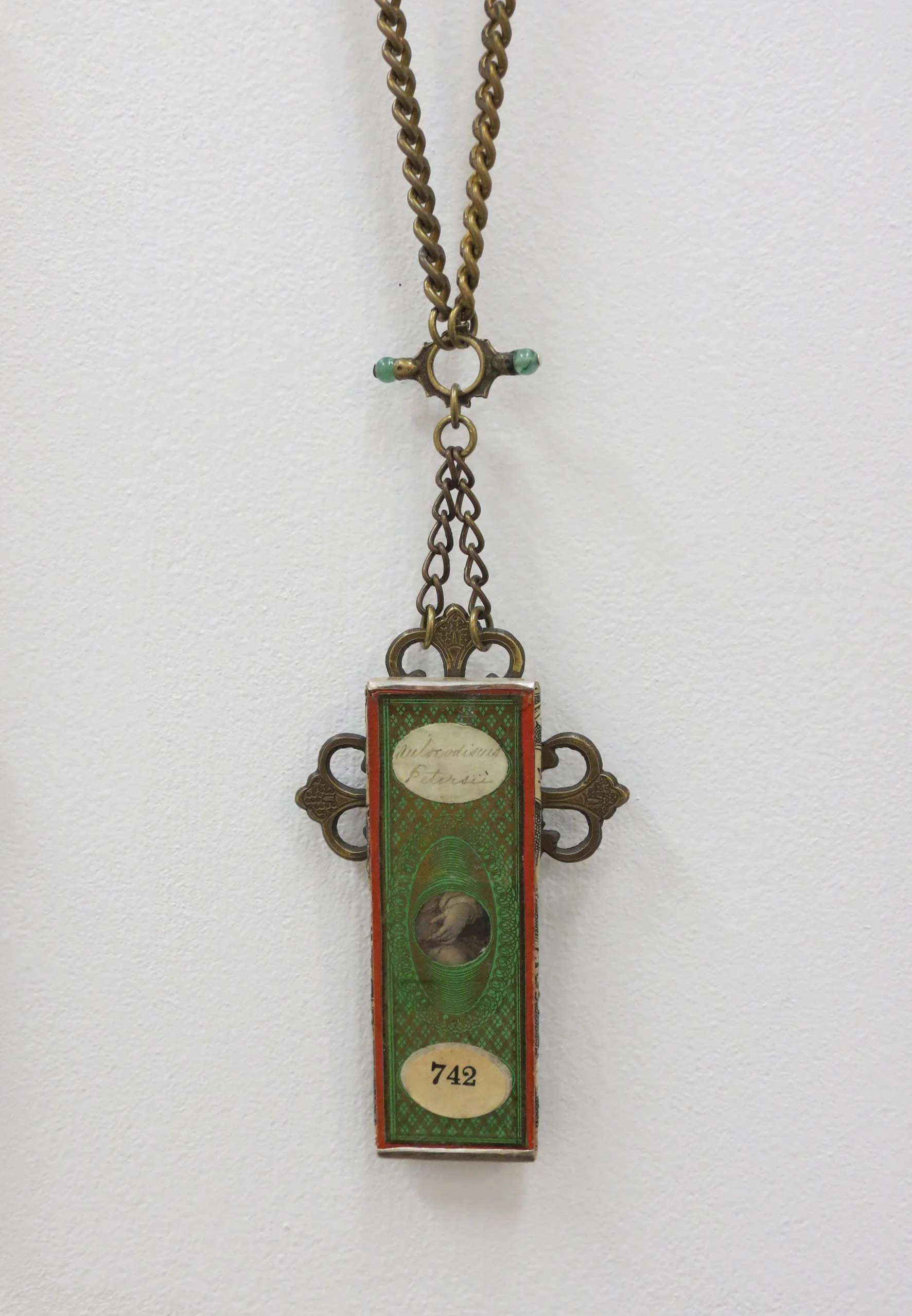  6. Kathy Aspinall, 'Manus 742', 2018, Victorian papered slide, brass, antique paper, fob watch keys, chain, silver, necklace, $495 