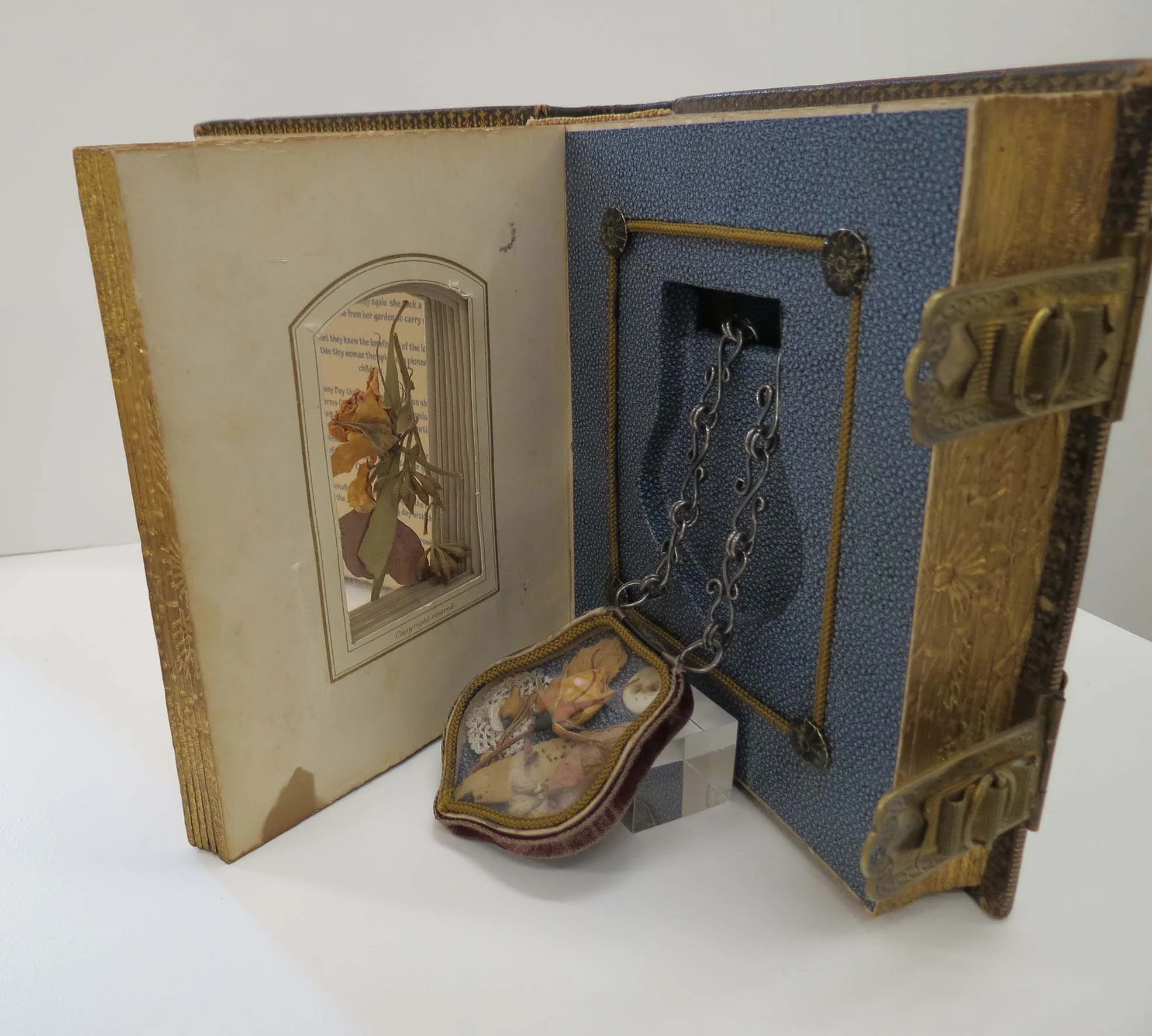  31. Kathy Aspinall, 'Charlotte's Rose', 2012, Victorian photograph album, personal ephemera, brass, story necklace, altered book, $1,200 