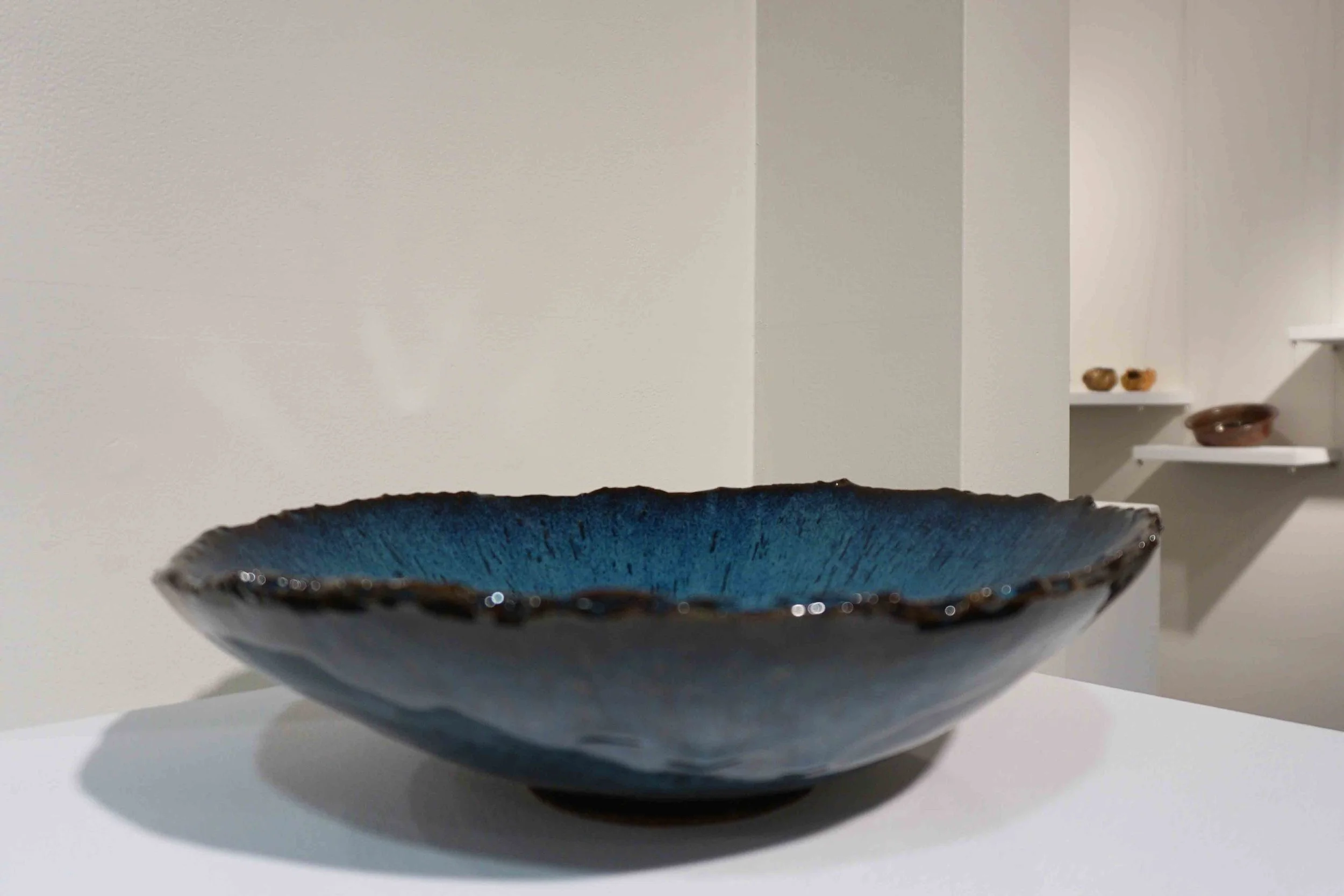  12. Sylvie Riches,  Grand Bol Bleu , 2018, hand built stoneware, blue glaze over tenmoku gold glaze. $180 