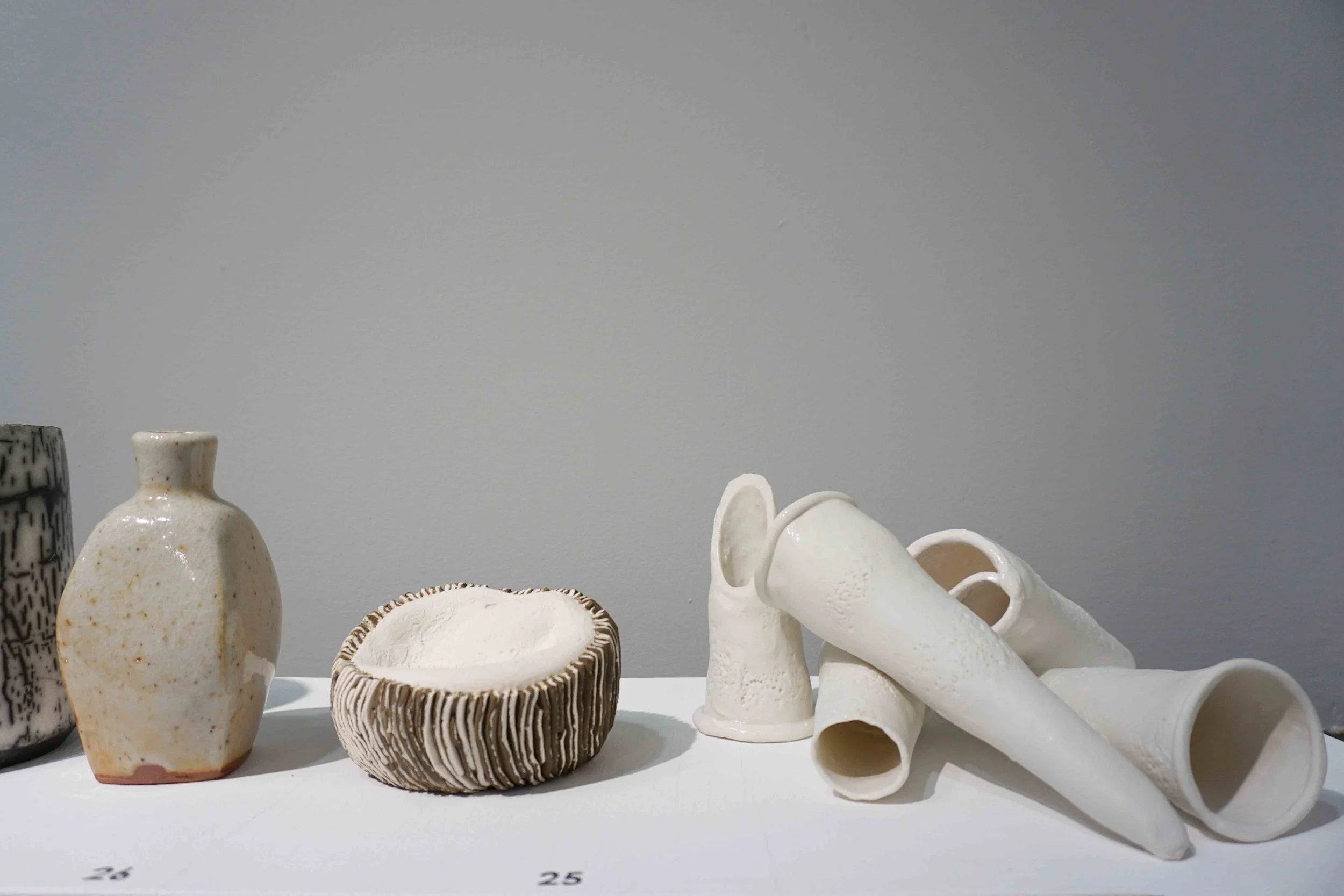  24. Graham Hay,  Venice Echoes , 2017, ceramic southern ice porcelain paper clay. $50 each. 25. Andrea Vinkovic,  Transition Series 1,  2018, terracotta, stoneware, porcelain clay. $180. 26. Greg Crowe,  Bottle II , 2018, woodfired glazed stoneware. $300. 