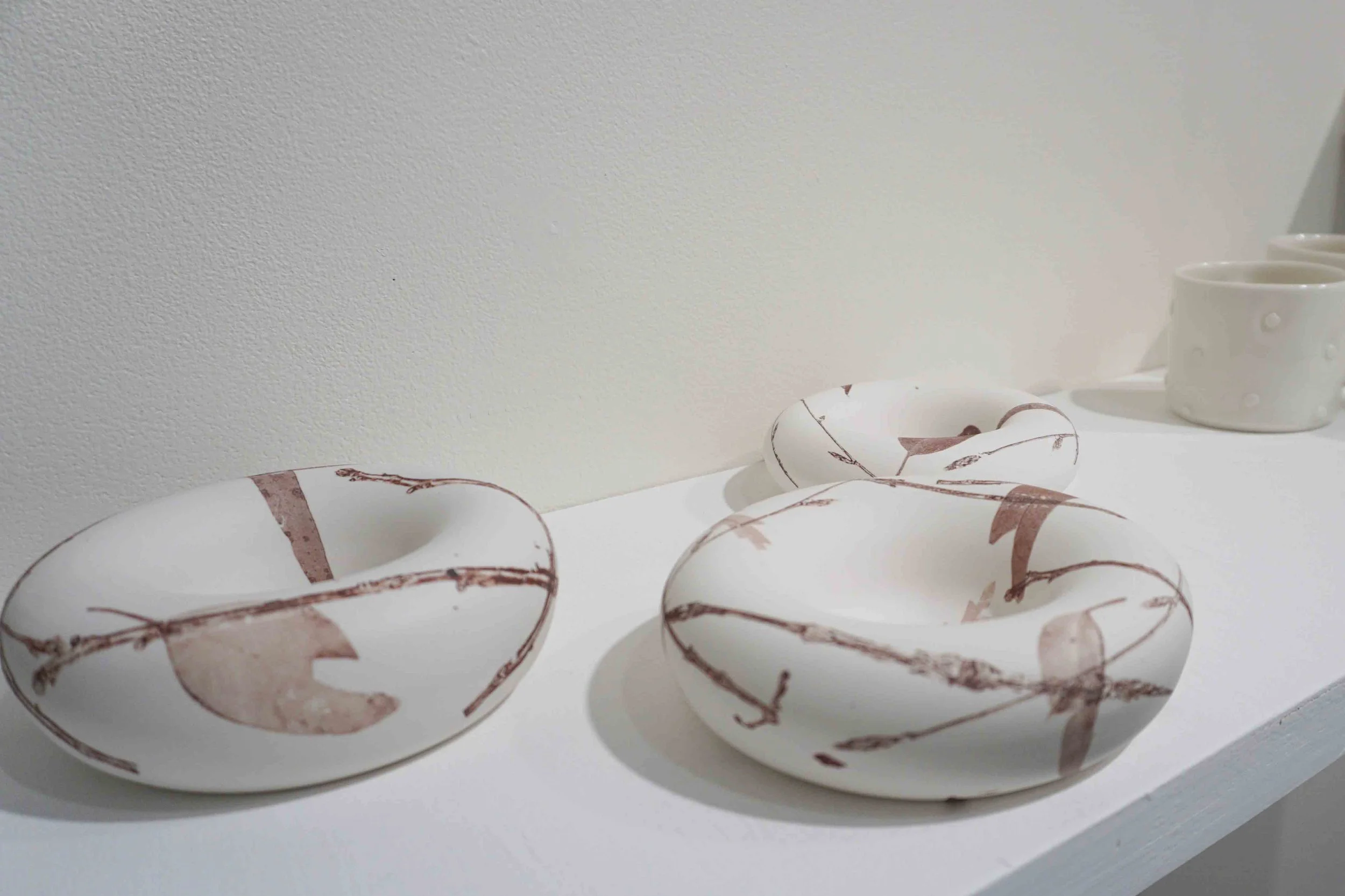  52. Elaine Bradley,  Nest I-III , 2018, unglazed procelain,iron oxide decal. $200 each 