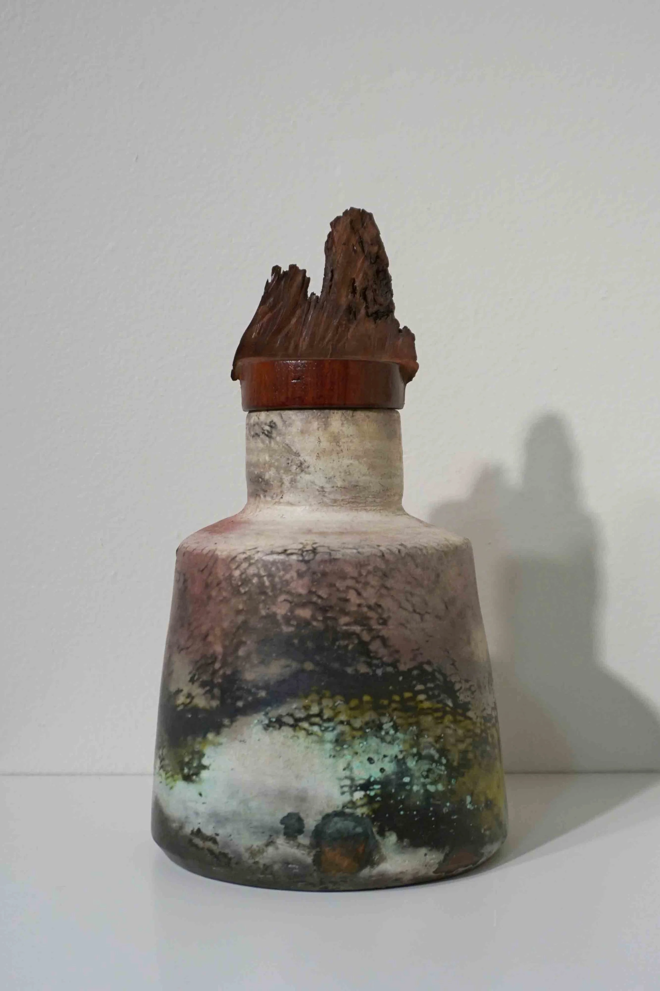  15. Cathy Swioklo,  Fury (large) , 2019, pit fired ceramic vessel, jarrah lid, collaboration with John Swioklo, water resistant, not food safe, 24 x 12 x 12 cm $110 