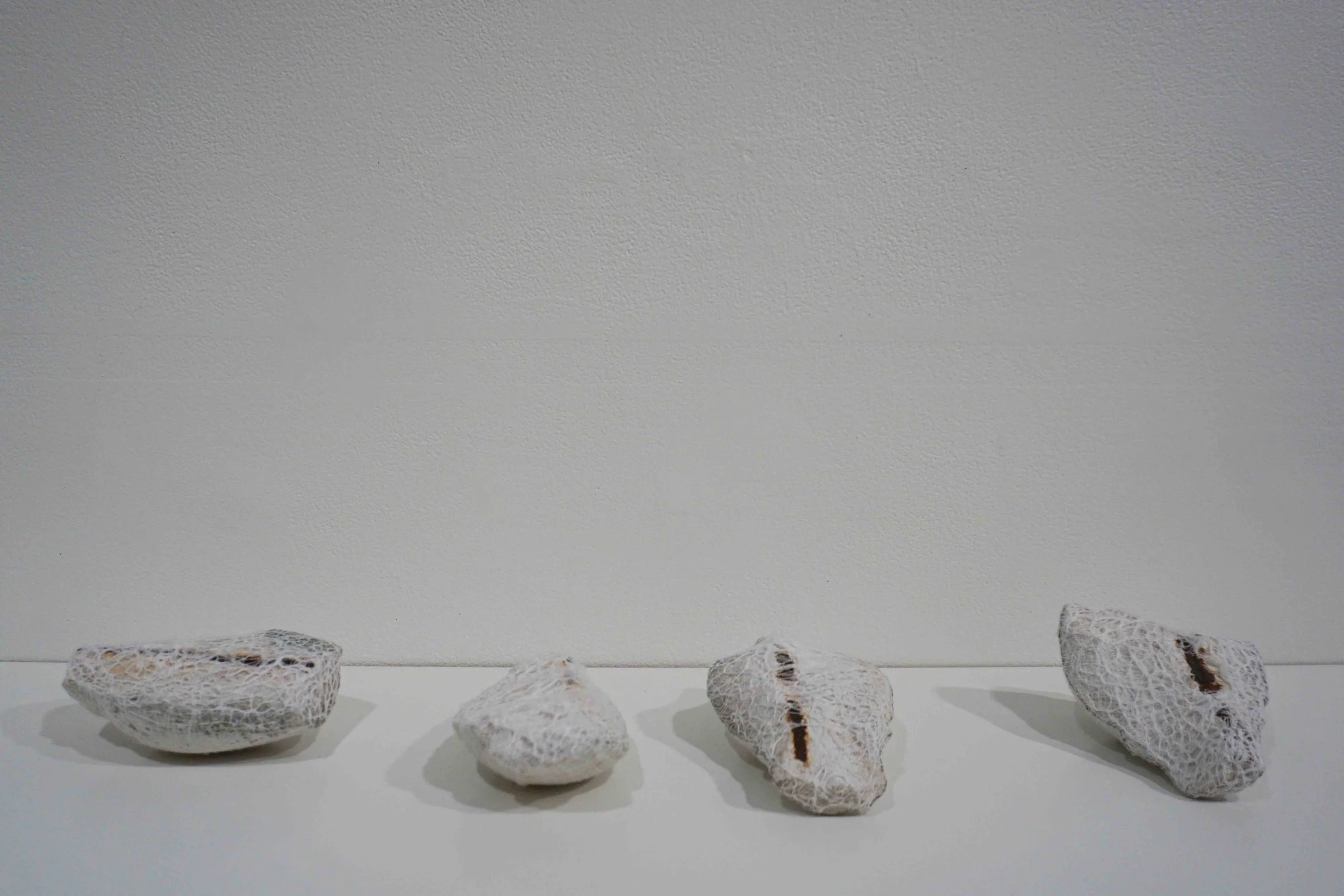  13. Melanie Dare,  Mending broken boundaries series  (d-g), 2019, concrete fence pillar, gauze and thread, dimensions variable 