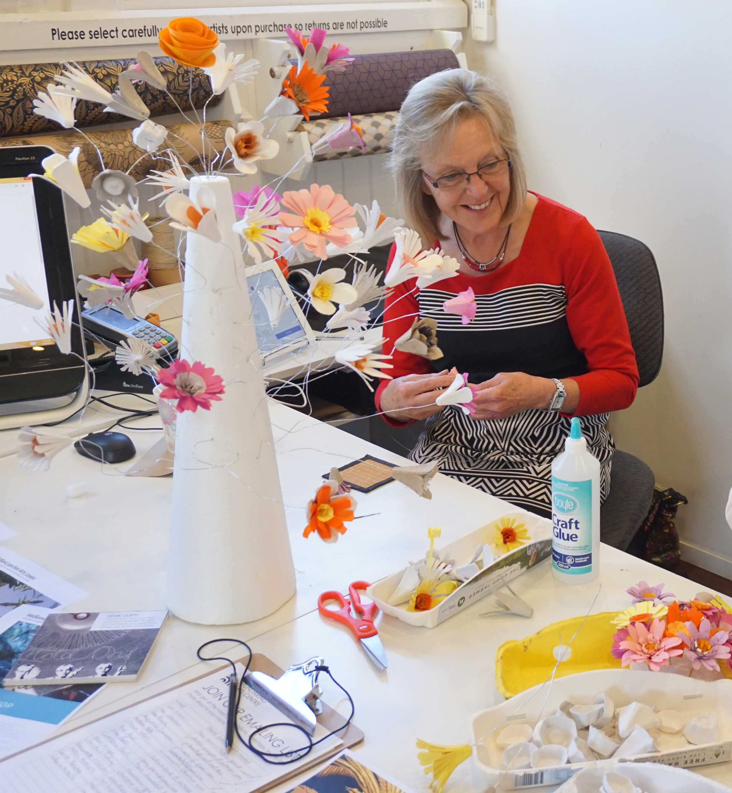 Anne finishing offf the What On Earth Flowers ready for install.jpg
