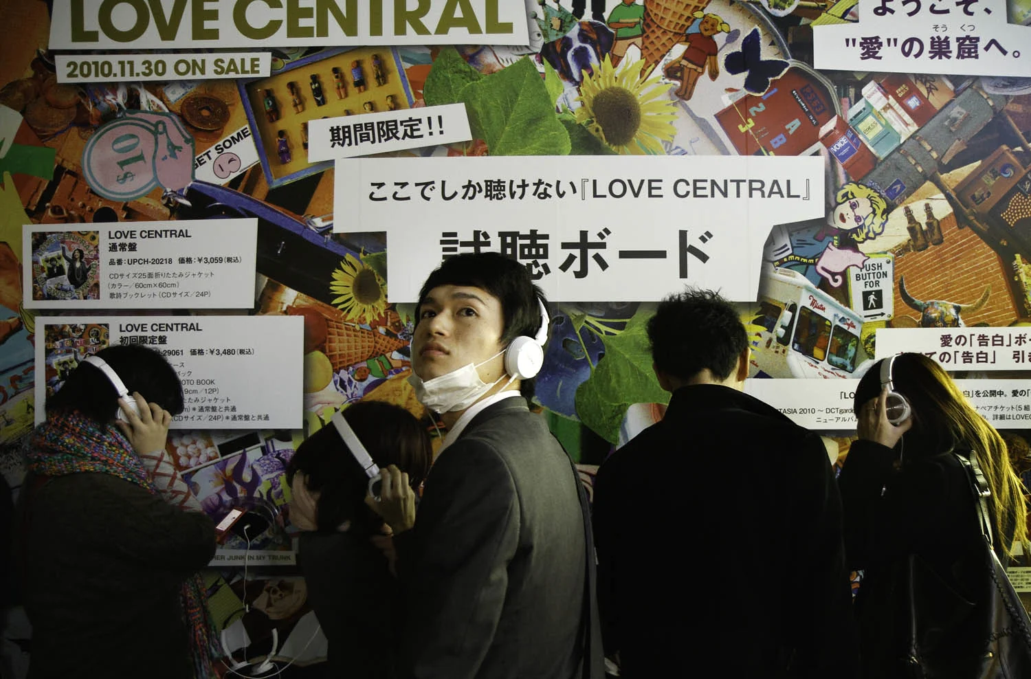 Tokyo’s Harajuku area is famous for its trendy teen fashion scene. Here young people listen to headphones at an outdoor music installment.