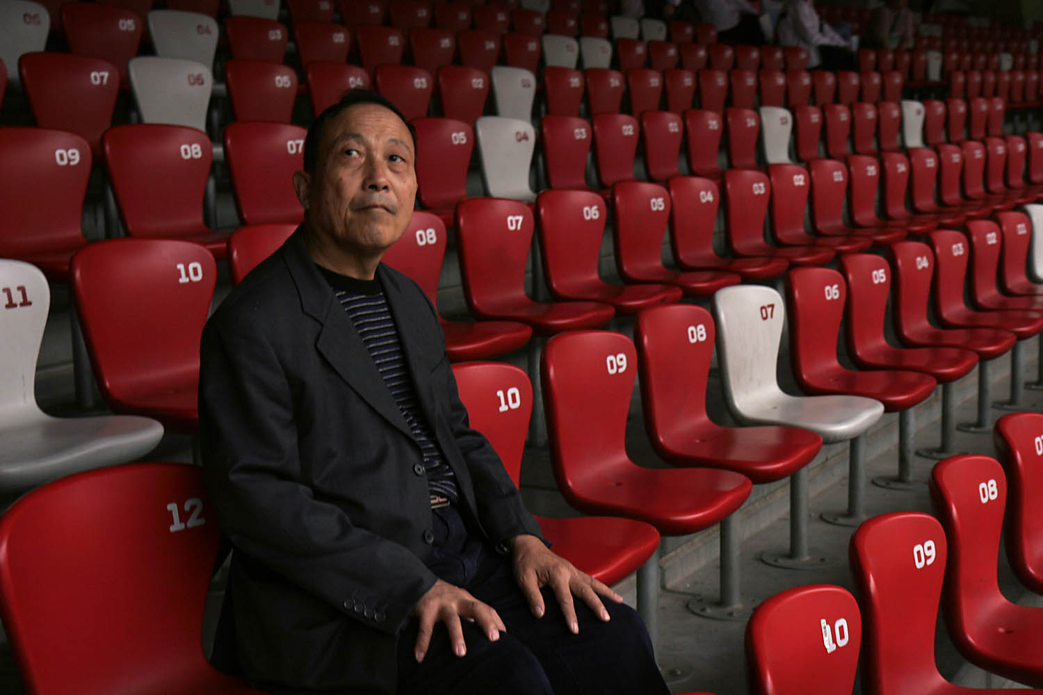  A visitor examines the interior of the empty Bird's Nest stadium used during the 2008 Summer Olympics held in Beijing, China. More than a year after the Olympic games, the stadium's owners are still having difficulty scheduling events in the 80,000 