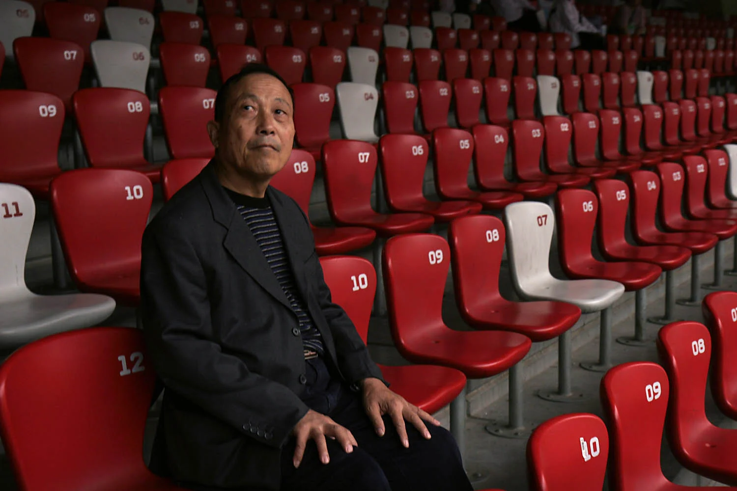 A visitor examines the interior of the empty Bird's Nest stadium used during the 2008 Summer Olympics held in Beijing, China. More than a year after the Olympic games, the stadium's owners are still having difficulty scheduling events in the 80,000 seat arena.