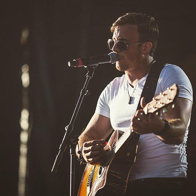 Eric Ethridge - winner of Boots and Hearts upcoming artist 2015 wearing some Bear (HEN Jewelry's mens line) onstage