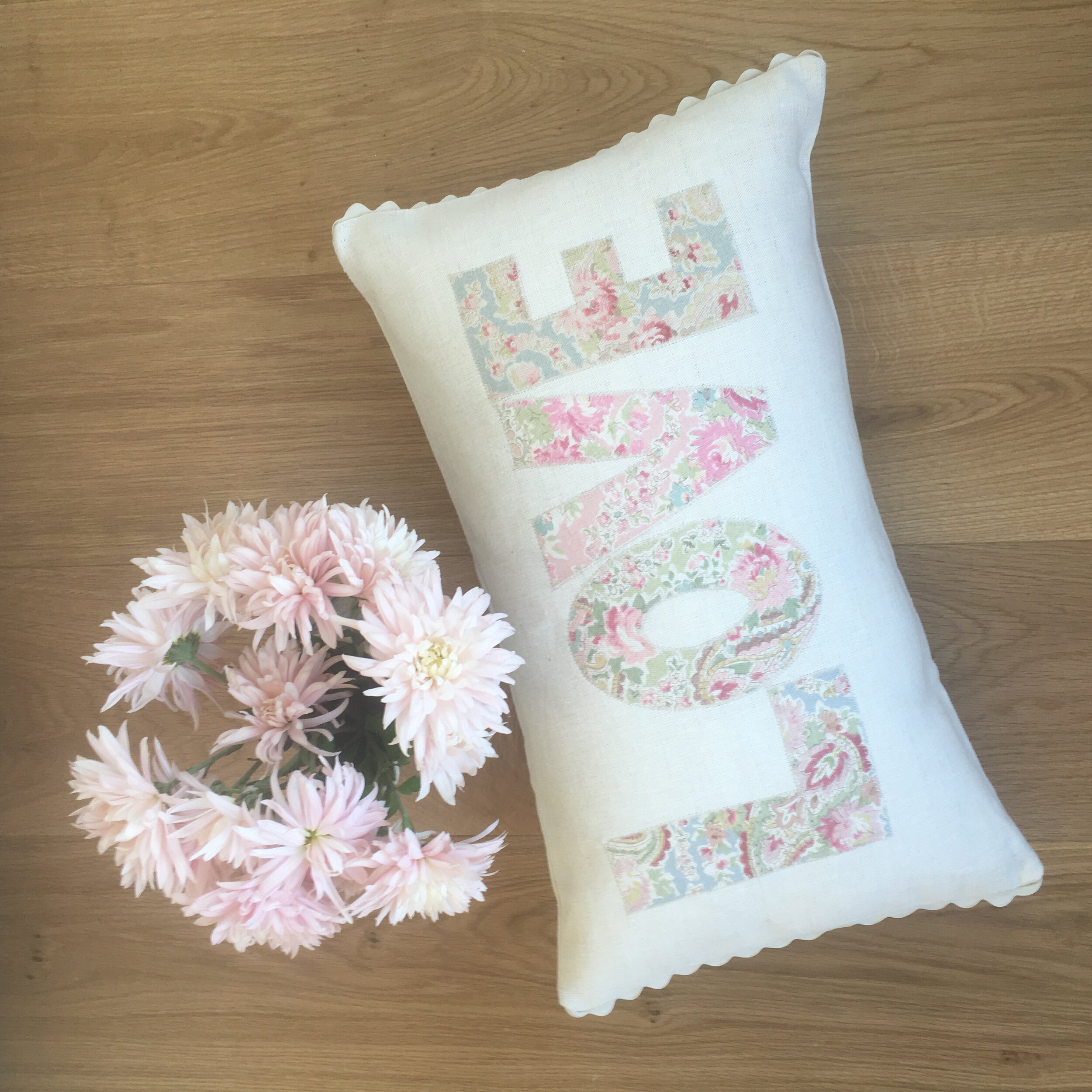 LOVE appliqué oblong cushion