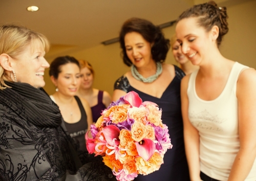 There is nothing quite so wonderful as presenting the long-awaited bouquet to the bride.... each and every time! Image Stina Booth Photography