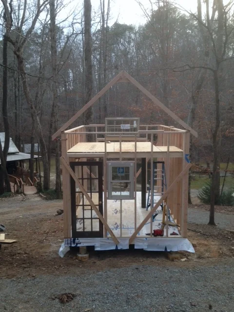 I love this part of building, where it really starts to look like a house! The window next to the door will be moved to the far right - into the bathroom. The window you see at the far end is tacked in place where there is current framing. I need to re-do that framing because the original placement was just going to be too high.