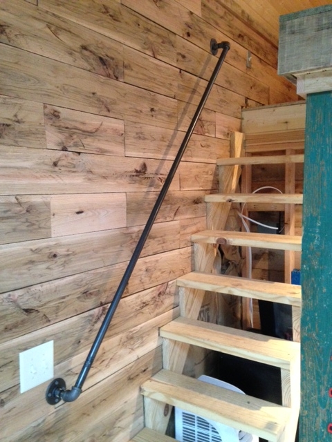 I like the industrial look of the plumbing pipe used for handrails.