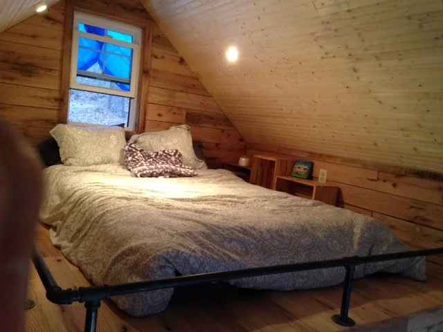 We put a queen mattress in the loft. I was going to build a platform, but we think it's pretty comfortable just on the floor.