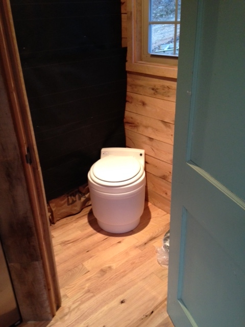 One of the exterior walls of the bathroom still needs to be completed, but it serves its purpose.