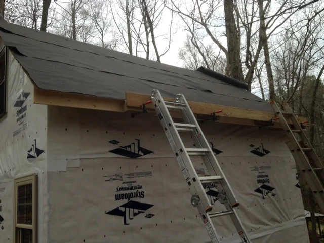 We got the roofing felt up, then had to figure out how we were going to install the metal...