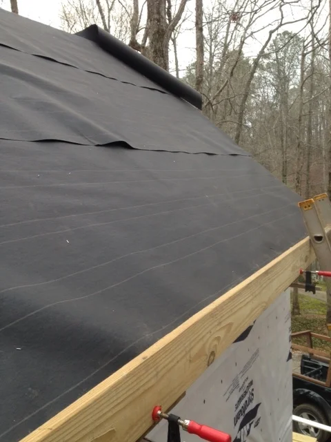 Glad to have an engineer around! We made a toe board by attaching 4x4s to a deck board, then clamping them to the fascia. It worked very well. 