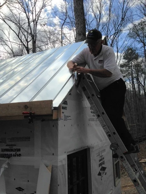 My dad doing a little work on the drip edge. Couldn't have put this roof on without his help.