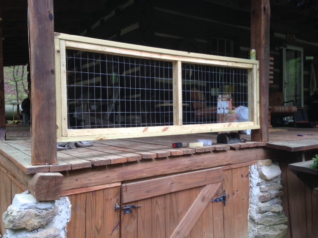 My first test section of our porch. Once it is stained, I think it will fit well with the style of the cabin. It allows us to see more than a typical balustered railing would. 