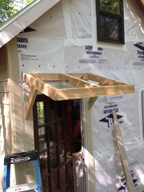 The door mat was perpetually wet. I decided an overhang would add to the detail of the house, and keep things a little dryer. 