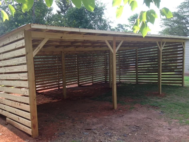 There was a 50-year old barn standing on a piece of the property. We pulled it down, salvaged what little wood we could, and built this rustic carport.