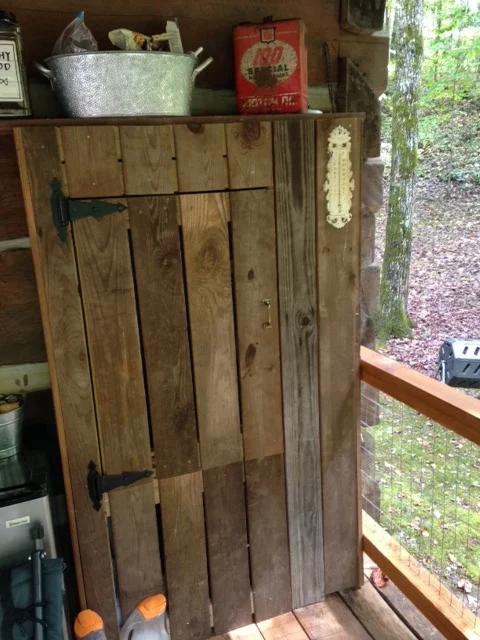 Most of the old wood from the barn was destroyed by rot and insects. I was able to save enough to build this - behind the door is the electrical panel and meter for our cabin.