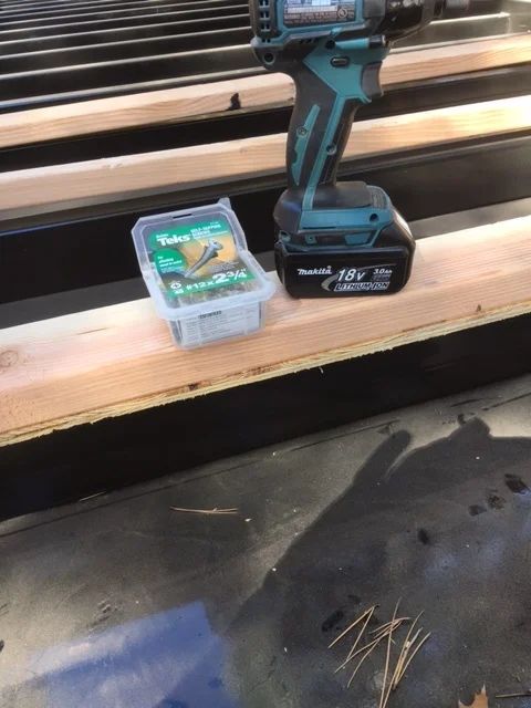 I cut 1/2" plywood into strips, then laid the 2x4 flat to bring the floor level with the outside. 