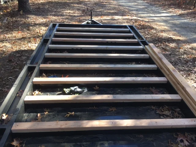 The adhesive and screws make the wood feel every bit as solid as the steel. The subflooring will overlap to the steel on the outside, tying it all together.