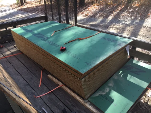 This stack of sheathing panels weighs almost a ton. 