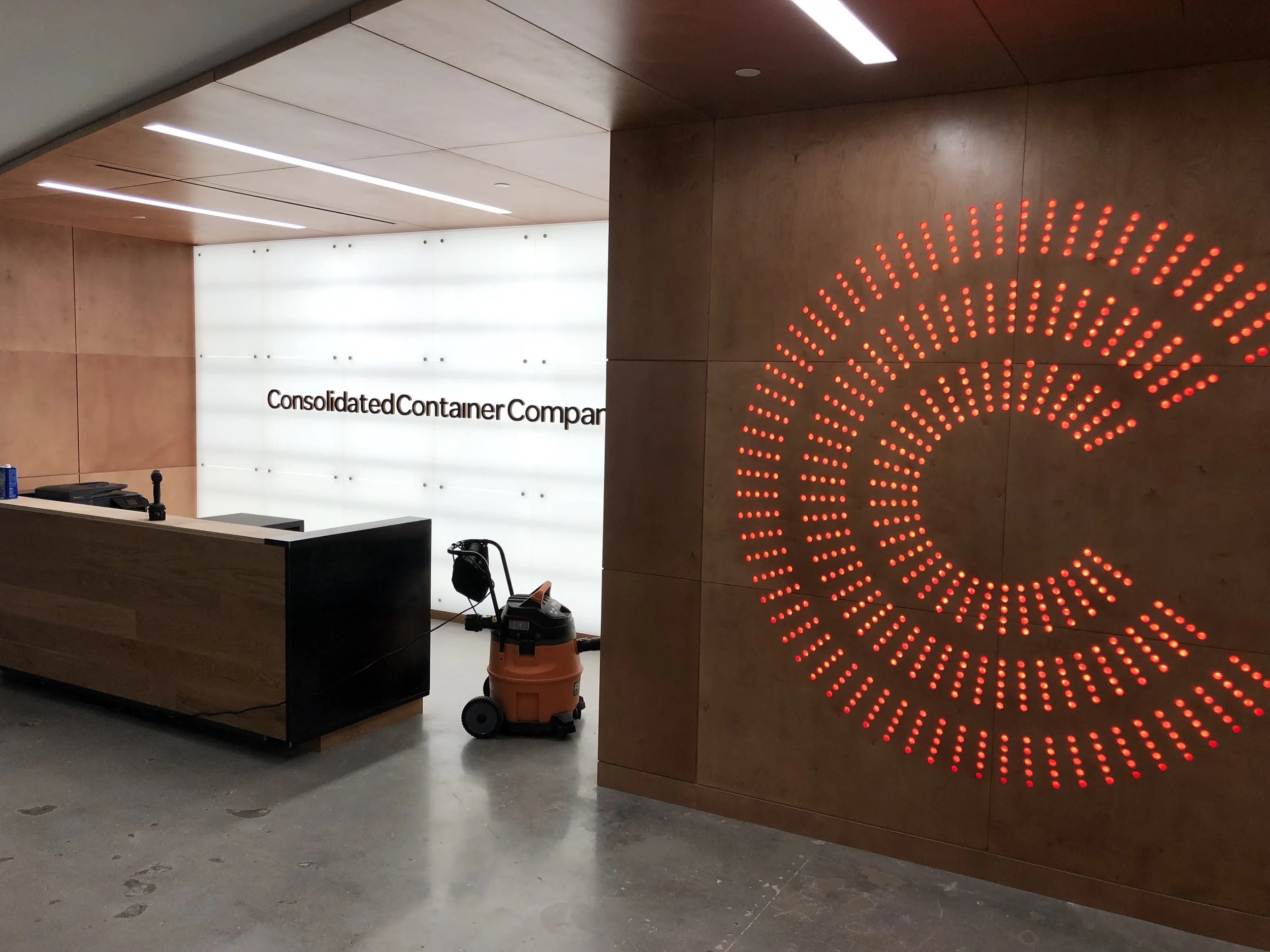 This was a fun day! We installed this 8 foot tall logo, which was CNC-machined in six different panels. The panels were put together and then sandwiched with red-tinted plexiglass between over 3,000 LED lights. We then pivoted the entire unit up onto the wall. That was a few tense moments!