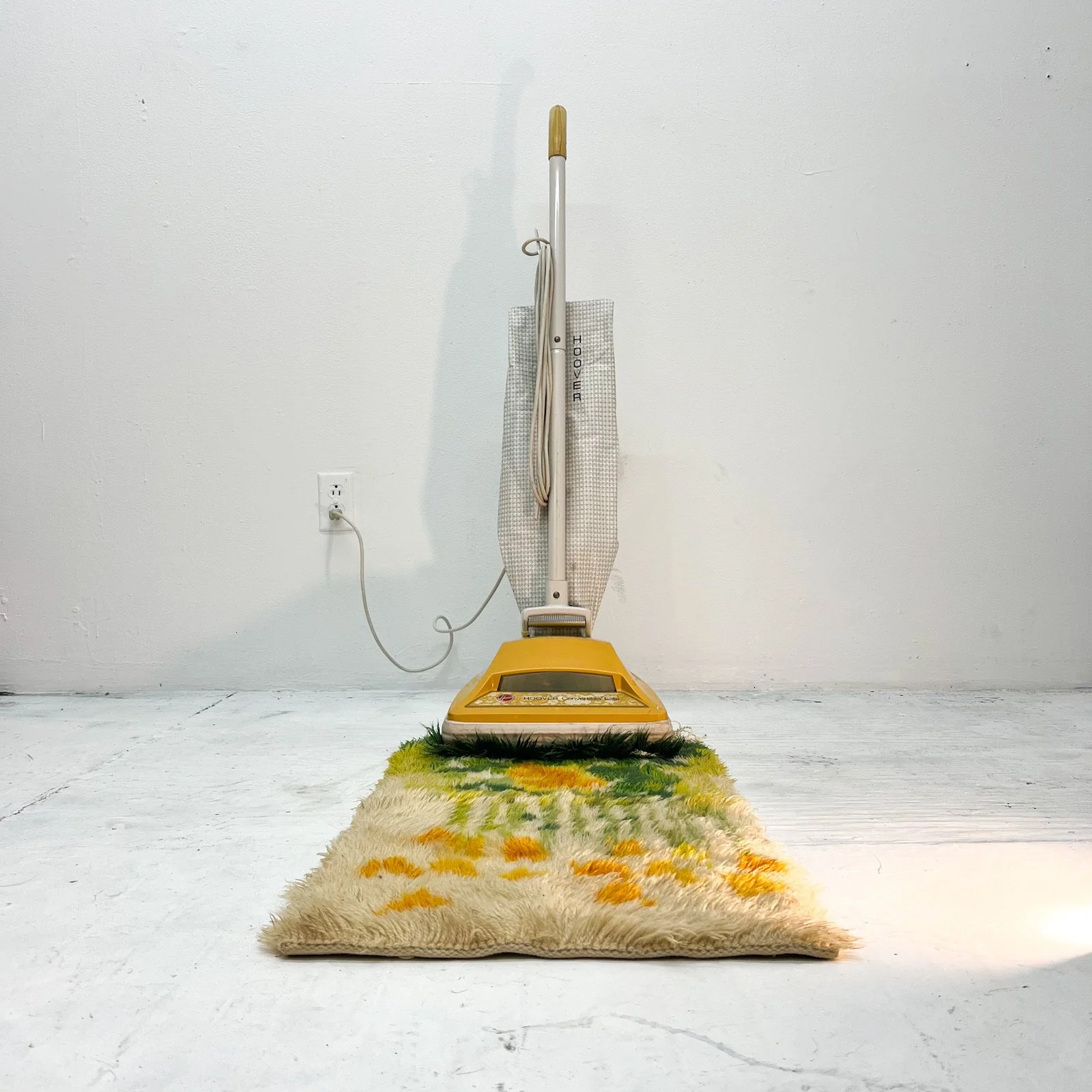  'Stuck', Vacuum, partially shredded shag rug. 2024 