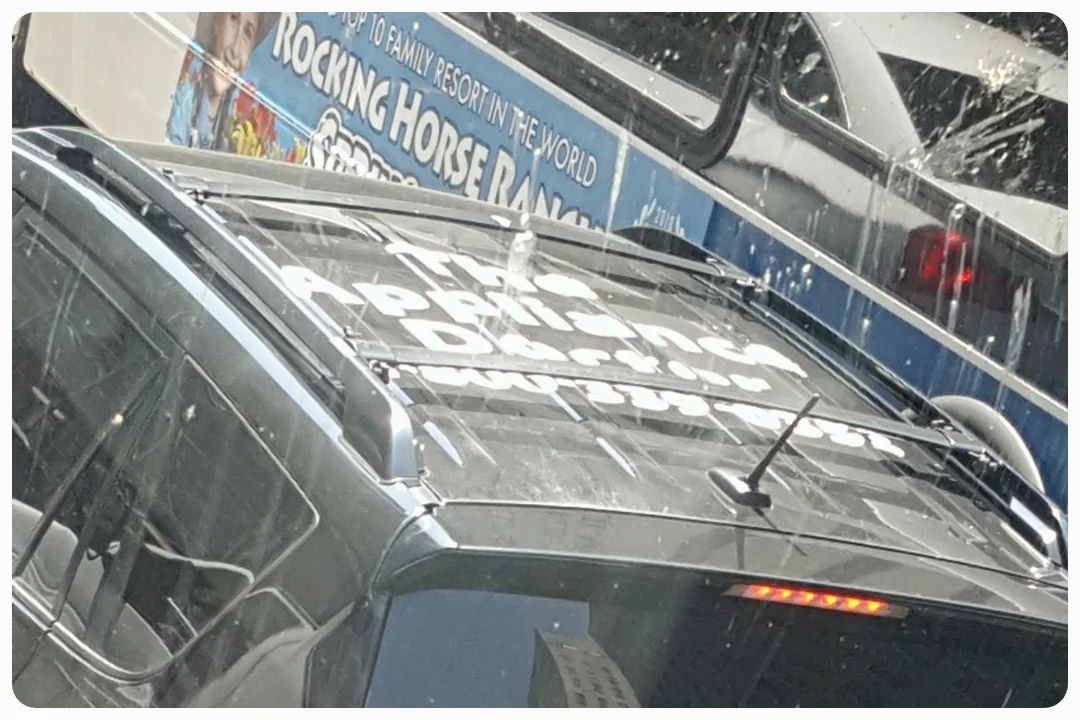 You know you're in a city of 100% highrises when they put ads on the roofs of cars. 