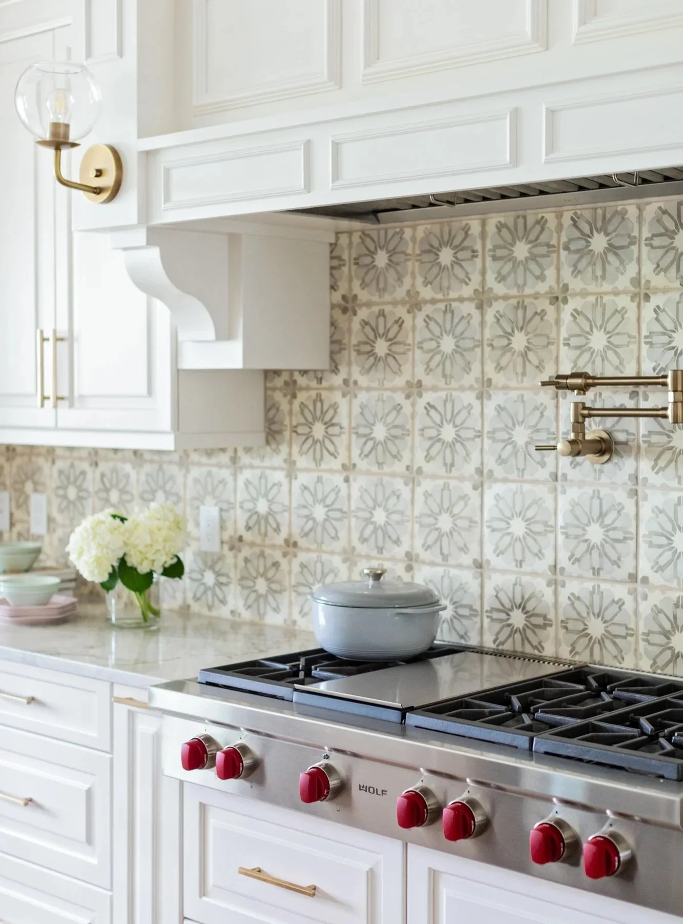 Traditional withe kitchen with wood paneling and graphic tiles tampa