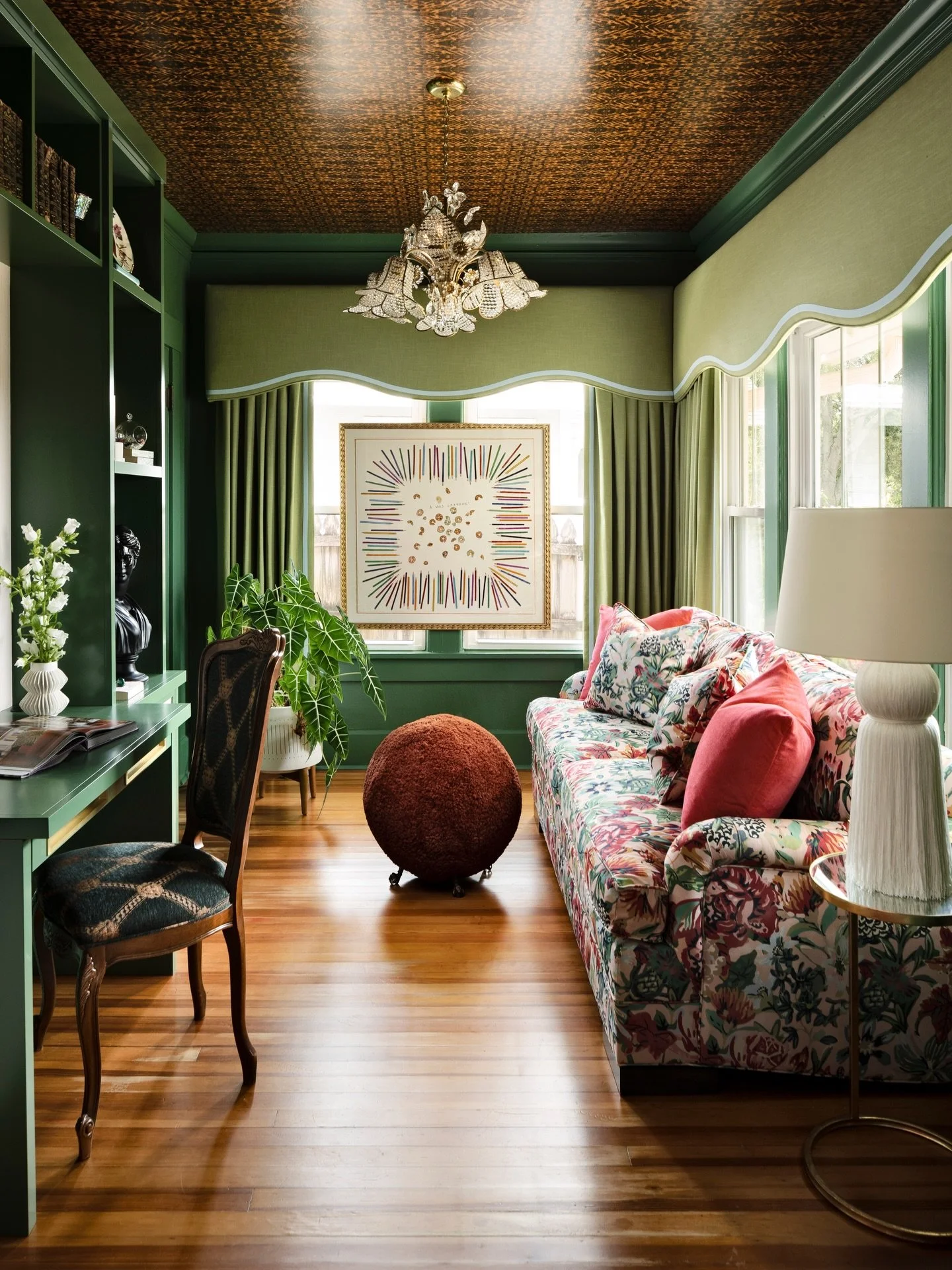 Happy St. Patrick&rsquo;s Day 🍀  Home office/den wrapped in shades of green and golden hues in a charming historic Florida bungalow  
Ceiling Wallpaper: @jimthompson.official
Vintage Chandelier from France
Art: @hermes scarf
Sofa: @vanguardfurnit
