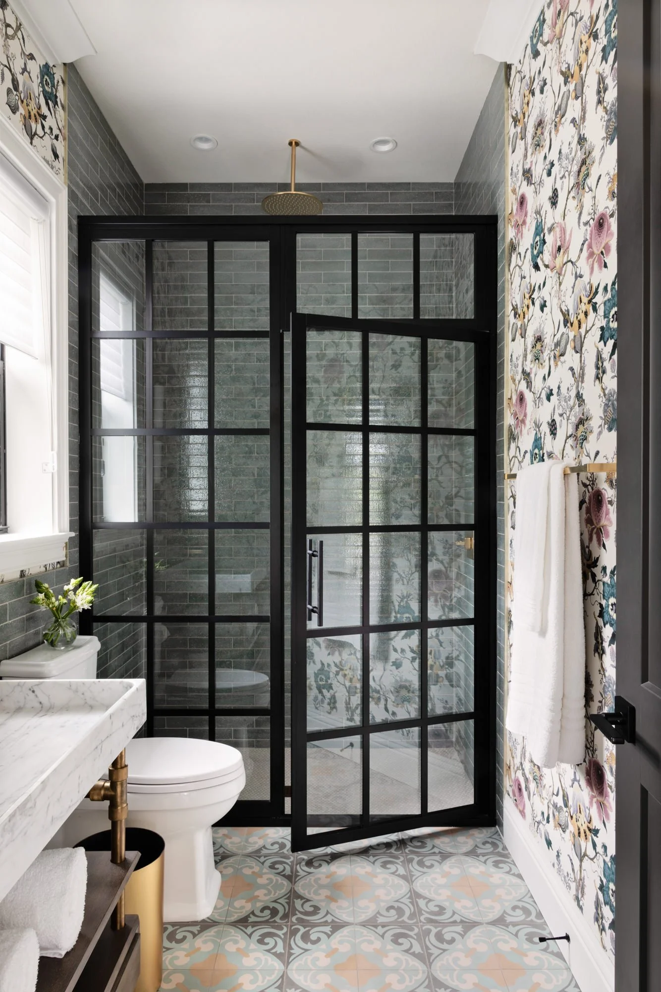 floral wallpaper and panelled glass doors bathroom tampa