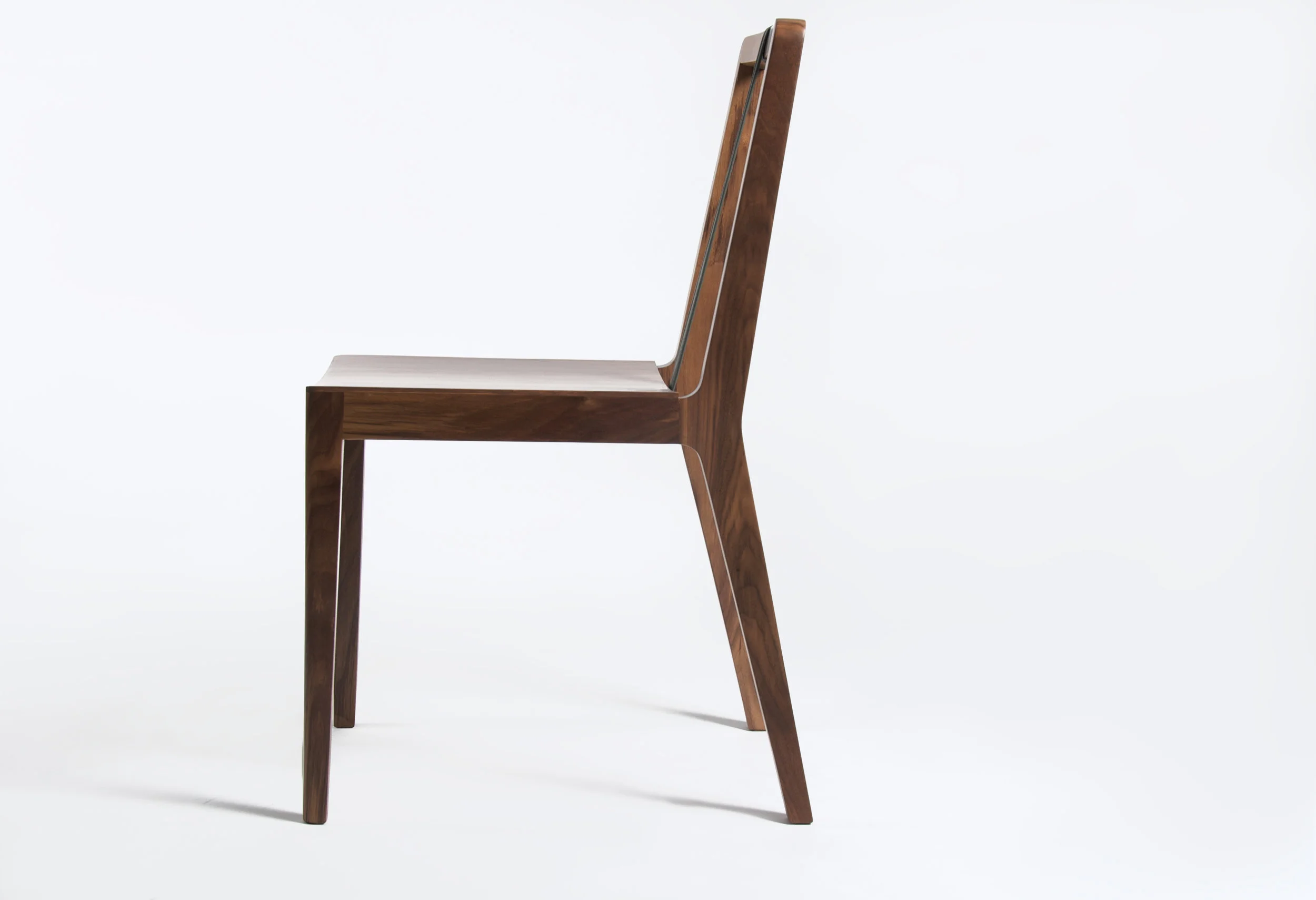 2010 / Chair / Maple, walnut, plywood, leather / Client-Producer: Bauhaus Möbel® / Awarded National Design Biennial 2011 Over time the tie and suspenders have been important symbols in fashion history. The Tie Chair uses these functional and decorative elements to acquire its own identity by using leather ribbons, this gives not only a determined aesthetic personality but also give support and security in the back area.