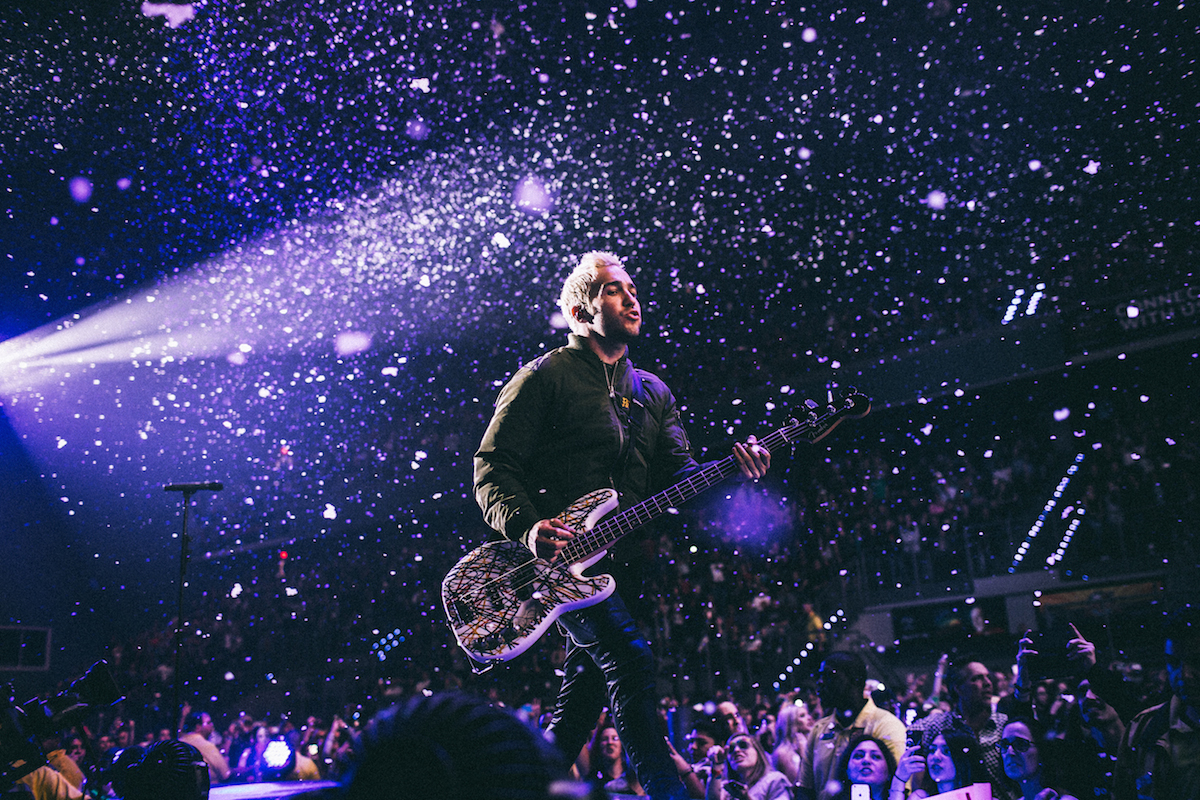 Fall Out Boy / Wintour - Hollywood, FL This was a night that started out as a disaster but ended up being one of my favorite shows to ever shoot. On idobiRadio, I try to be as fair as possible and grant show credentials equally among the photographers on the team, even if that means I have to pass on some shows I’d really like to shoot. This was one of them. At last minute, one of our photographers was unable to make it to their date so I had to contact Fall Out Boy’s publicist and let them know we had to skip. When the week was approaching to shoot their show in my town, I wanted to shoot it so bad. And since it was Fall Out Boy, I didn’t want to step on too many toes and annoy their PR about setting up another press pass. So a couple of days before the show, I reached out to my boss on idobi to see what he could do and weirdly enough, he said Pete Wentz had it all set. Personally, I get nervous when anyone other than the publicist or mgmt sets up a photo pass for me. I’ve experienced many times the pass not being there and I’ll have no contact in hand except for a band or crew member who is most likely way too busy to come out and fix the issue. So I said whatever and took my chances and went. When I got there, the situation kind of sucked. I was a little late and it was the kind of show where you had to be escorted to the photo pit (the worst) and the person to escort us wasn’t there. When the person did come to escort me, she claimed I was not on the press list and my heart suuuuunk. I was about to make my way back home but just before I left I decided to give the will call booth a shot even though the escort repeatedly told me they would not have anything press related. Well jokes on her cause they had my pass, sucka! The show ended up being one of my top 5 favorite shows to ever shoot and the amount of regret I would have felt if I didn't check will call would have been so real. The production was one of the best I’ve ever seen and even though there was an extravagant catwalk, we were able to walk anywhere around it (usually with catwalks at shows you’re only able to shoot at the very end of it — at least from my experience). This image will probably never leave my portfolio. x x x