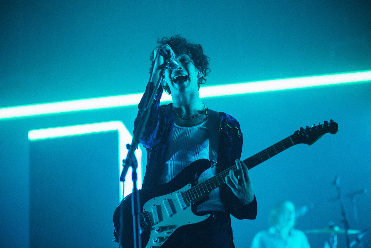 The 1975 / The 1975 Tour - Orlando, FL How can you go wrong with shooting The 1975 when they always have the best stage presence (hitting this with a period at the end cause this is not a question, it’s a fact). Back in May, I shot them in Miami and it was great except the venue was a little weird with their photo pit (there was actually a moat between the pit and stage which creates quite a bit of feet between you and the artist). After scoping out other photos of this run, I noticed this tour would have the same exact setup. It was kind of like getting a second chance to shoot the same tour , which was cool since you know what to expect lighting wise. For this shot, I took out my 85mm which I haven’t used at shows in ages. I thought these shots were a little boring at first, too clean, dead center, nothing too exciting going on in the background. In the end I decided not to delete these shots and discovered that my work needs more clean and clear images. I’ve always thought you needed something chaotic or extreme to make an interesting shot but I’m finally taking in the beauty of just a clean, simple still. x