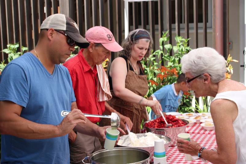 Volunteers serving strawberries at Strawberry Festival 2017