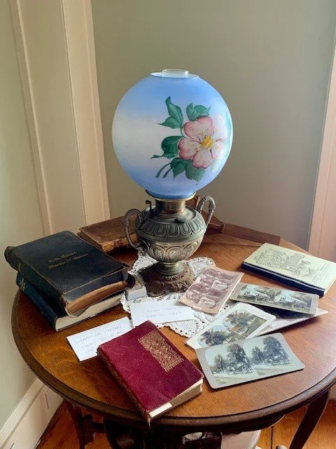 Artifacts_lamp books postcards.jpg