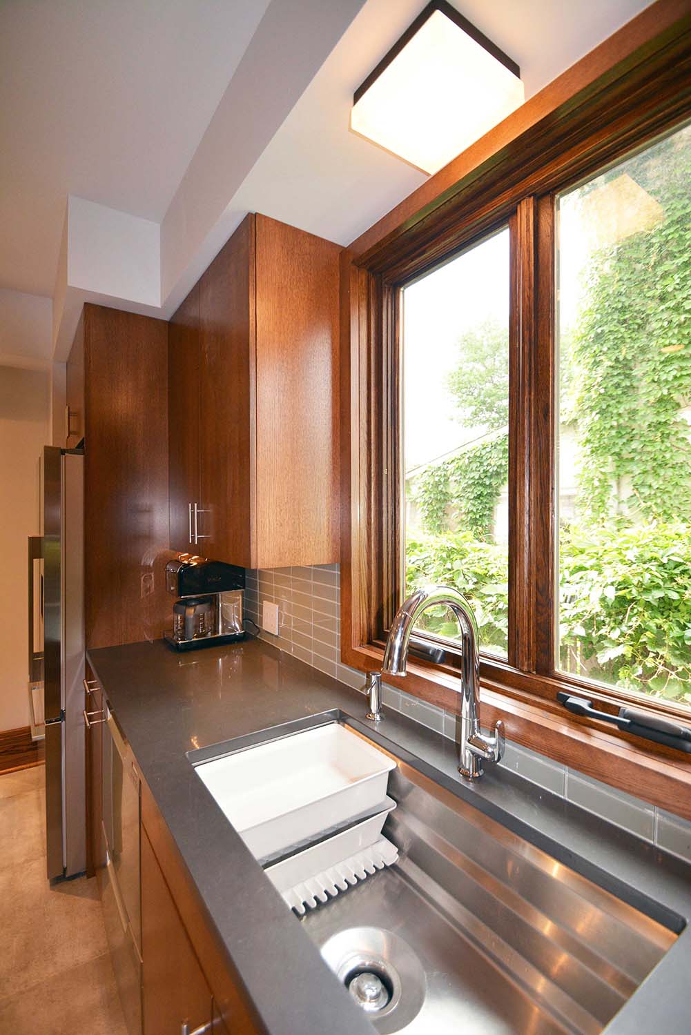 The new sink is a Kohler "Prolific" with movable, built-in drying racks, a smaller basin, and a cutting board (not shown)