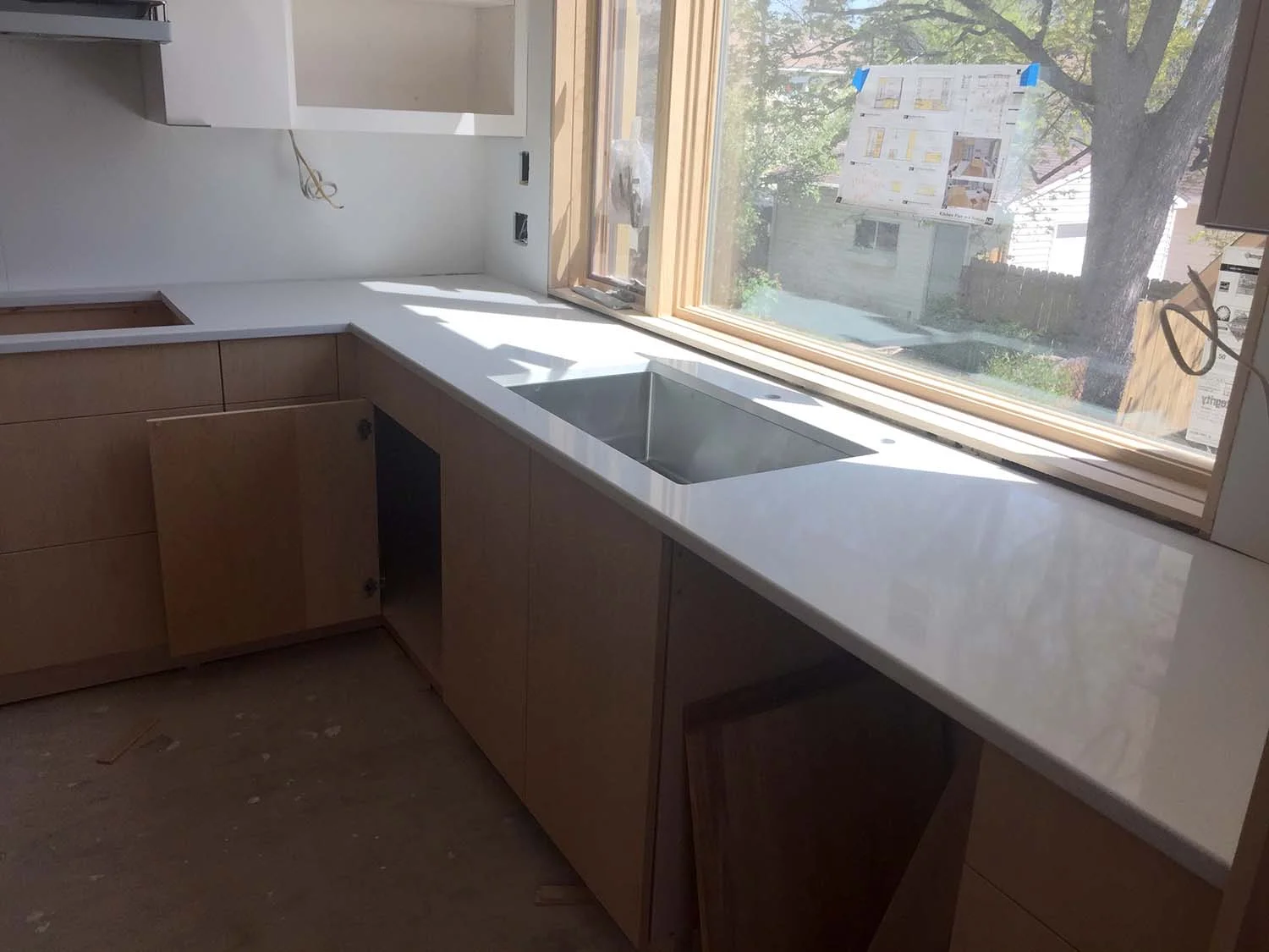 The countertop is HanStone Quartz, "Aurora Snow".