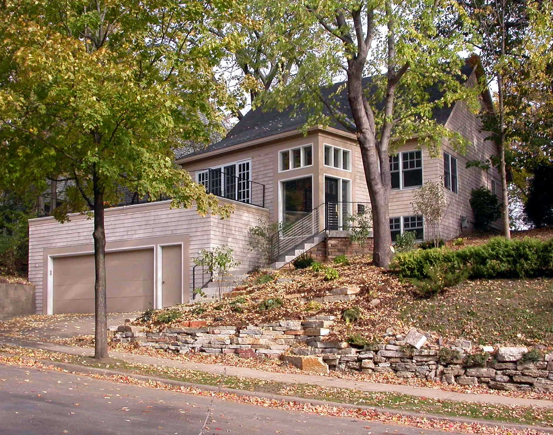 Addition/remodeling near Cedar Lake in Minneapolis, featuring a deck over the garage