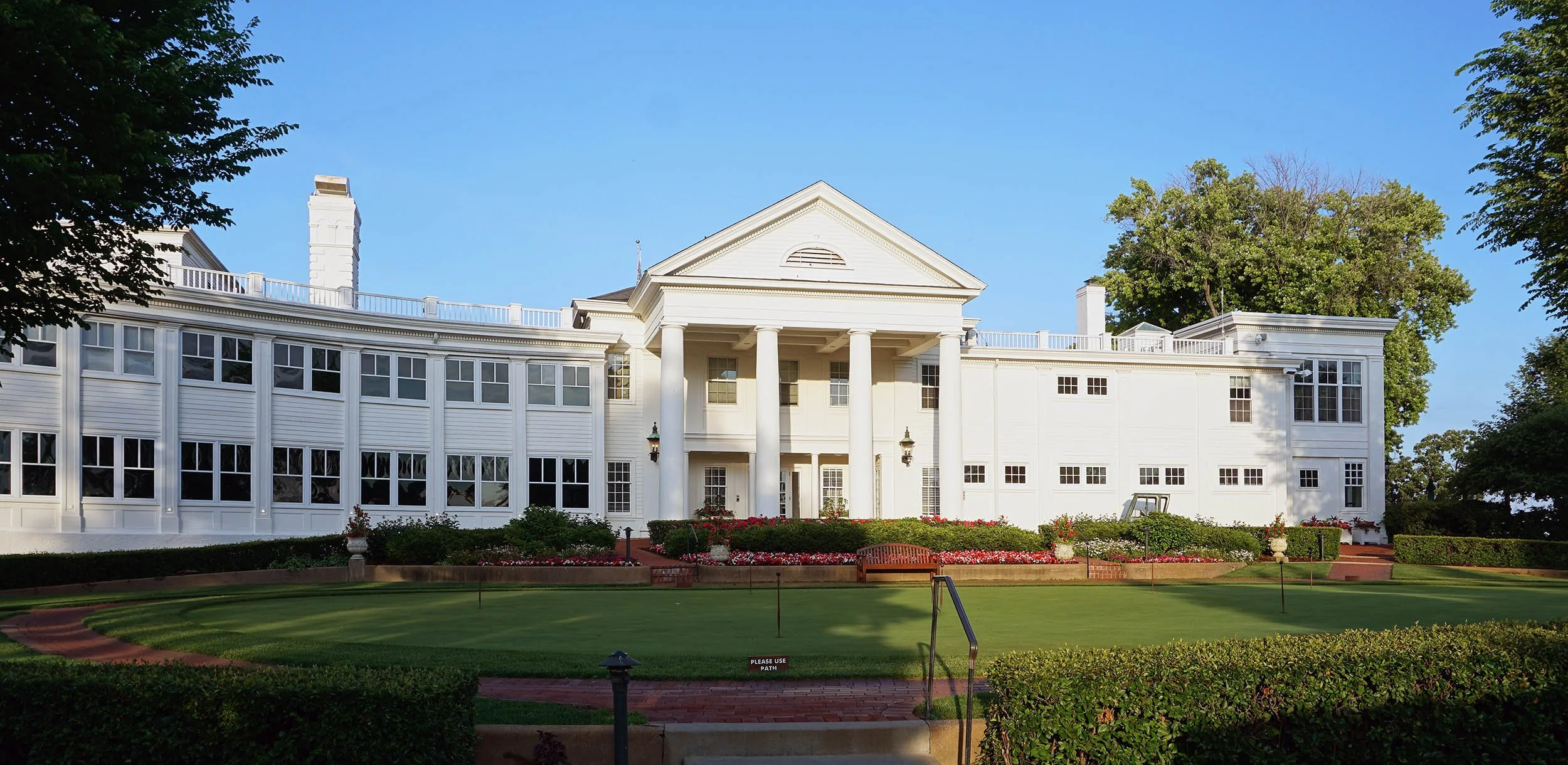  The main clubhouse’s west facade. Whereas the center entry is original, the wings have been substantially expanded and altered over the years. 