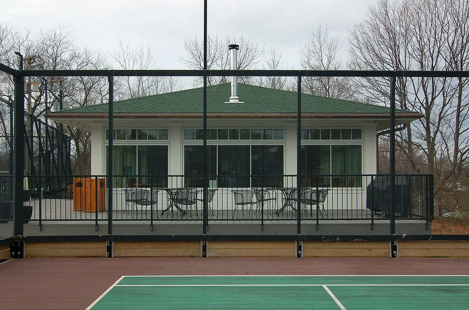  The new paddle house, designed in collaboration with Martha Yunker. This is a more informal facility, designed for socializing and for comfortable breaks between paddle tennis rounds.  General contractor: Pineview Builders, Inc. 