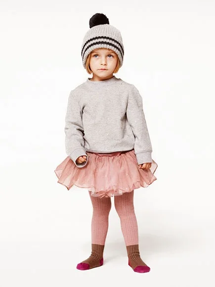 I am officially swooning… I LOVE HER! This Little Girl is Tutu Cute--outfitting her Tutu with a Pom-Pom Hat, Grey Heathered Sweatshirt, & Color-block Tights (all must have trends this winter, and will continue to be so with the frigid temperatures across the country). This Stella McCartney Gold Dot Tulle Party Skirt is also available in Honey and is an adorable Tulle party Skirt featuring embroidered Bow Appliqué in Pale Pink- perfect for Spring.