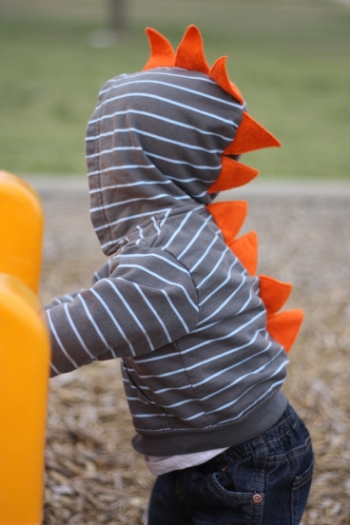 This Handmade Dino Hoodie is Made to Order from SwankyPankyDesigns at Etsy. I Love the Simplicity of this Character Hoodie while still having Big Personality with Dino Spikes going down the back. If you are Crafty and have a simple Hoodie, you can also DIY: See Vanessa Craft has an easy to follow Tutorial for making your own Dino Hoodie for your Little One, complete with downloadable template of the spikes. If your Little One is Dinosaur Obsessed, he or she will surely Live in this Character Hoodie!
